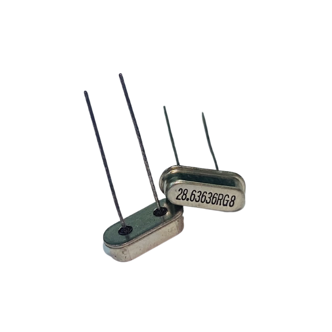 28.63636 MHz crystal, RG8 quartz crystal, RG8 crystal resonator, 28.63636 MHz oscillator crystal, through hole quartz crystal, PCB crystal component, RF timing crystal, quartz resonator electronics, frequency crystal component, microcontroller crystal oscillator