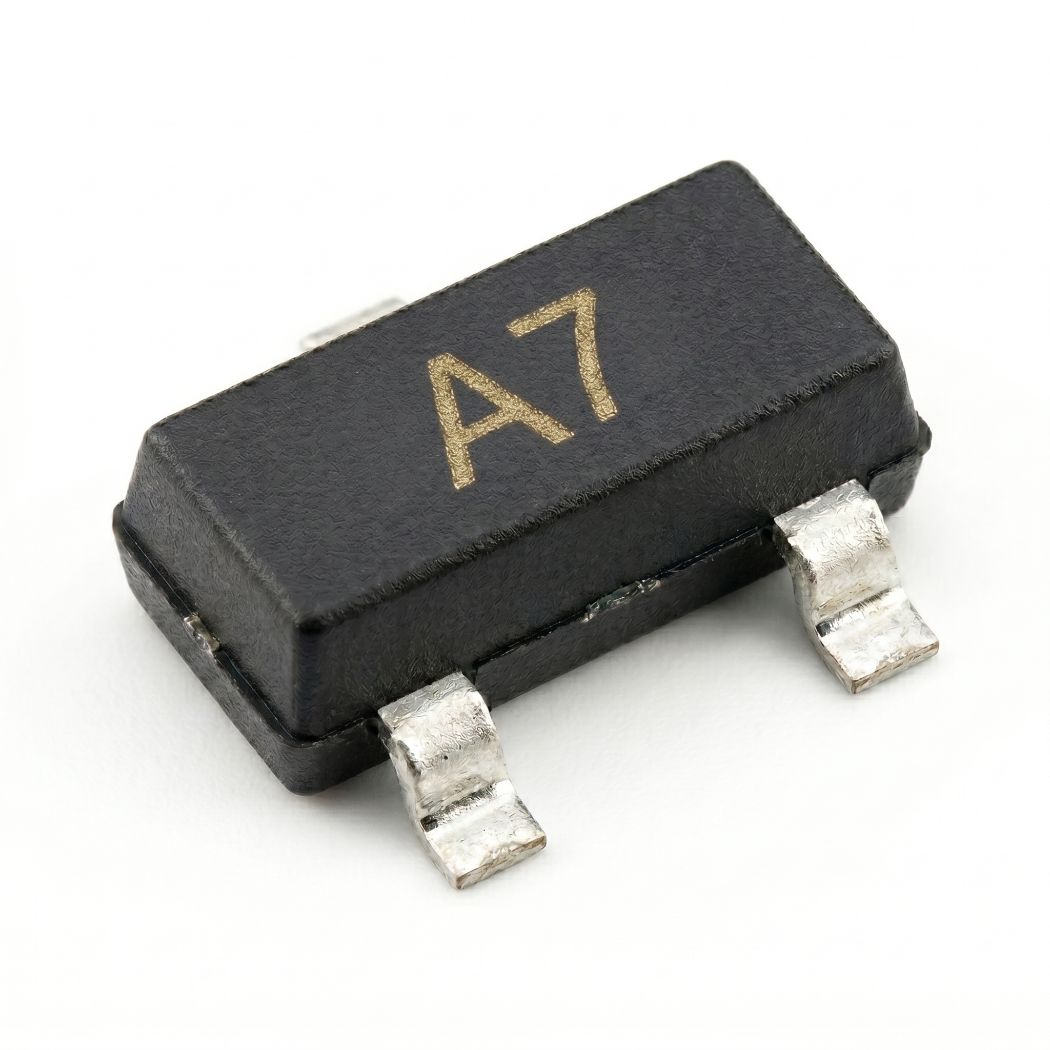 Detailed view of BAV99 high-speed switching SMD diode in a 3-pin SOT-23 package showing A7 marking.